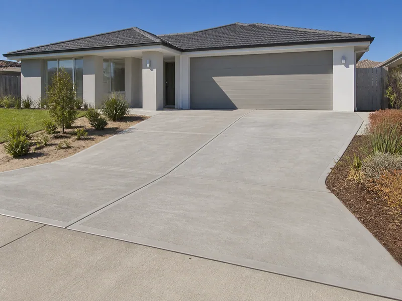 Finished grey concrete driveway at a modern Perth home